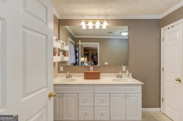 bathroom featuring crown molding, a textured ceiling, tile patterned flooring, and vanity