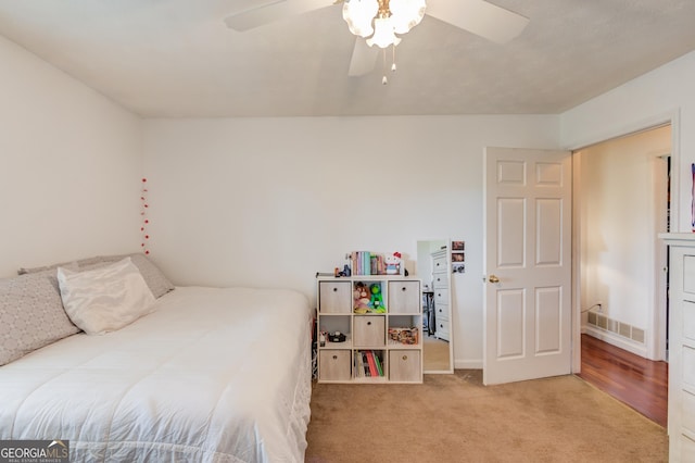 bedroom with ceiling fan and carpet floors