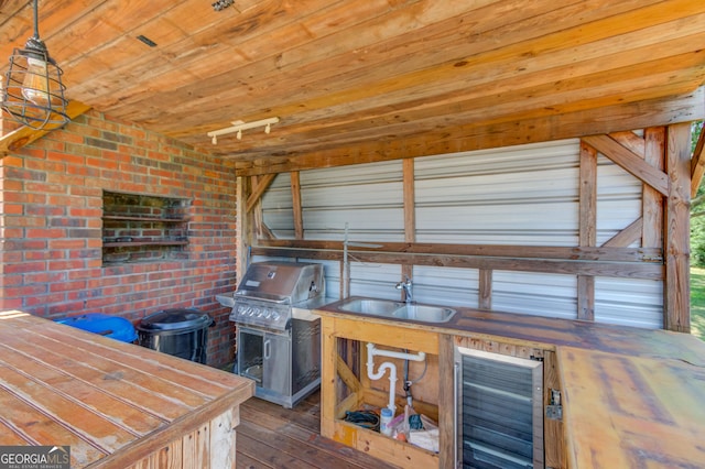 view of patio / terrace with sink and area for grilling