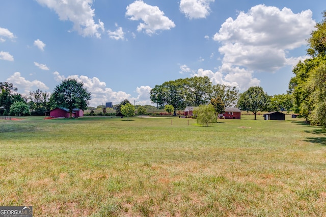 view of yard with a rural view