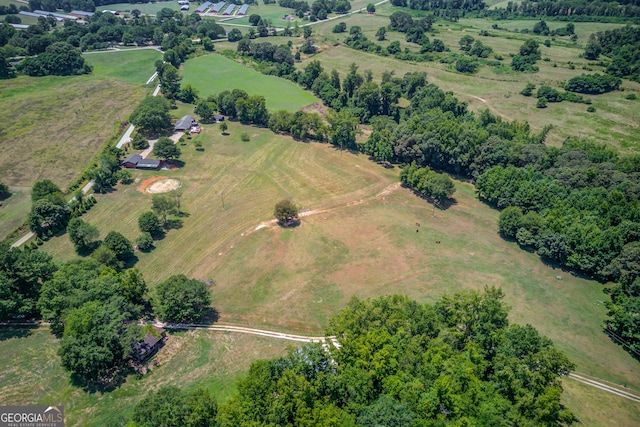 birds eye view of property with a rural view