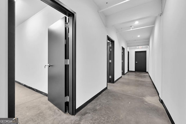 hallway featuring concrete flooring