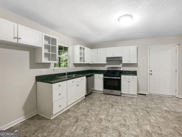 kitchen featuring white cabinets, a textured ceiling, appliances with stainless steel finishes, and sink