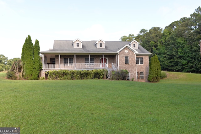 view of front facade featuring a front yard and a porch