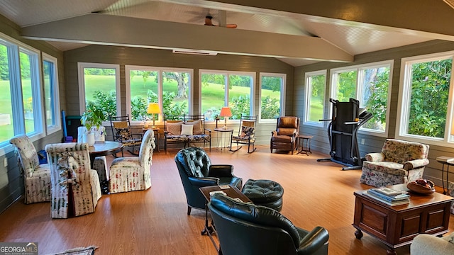 sunroom with lofted ceiling with beams