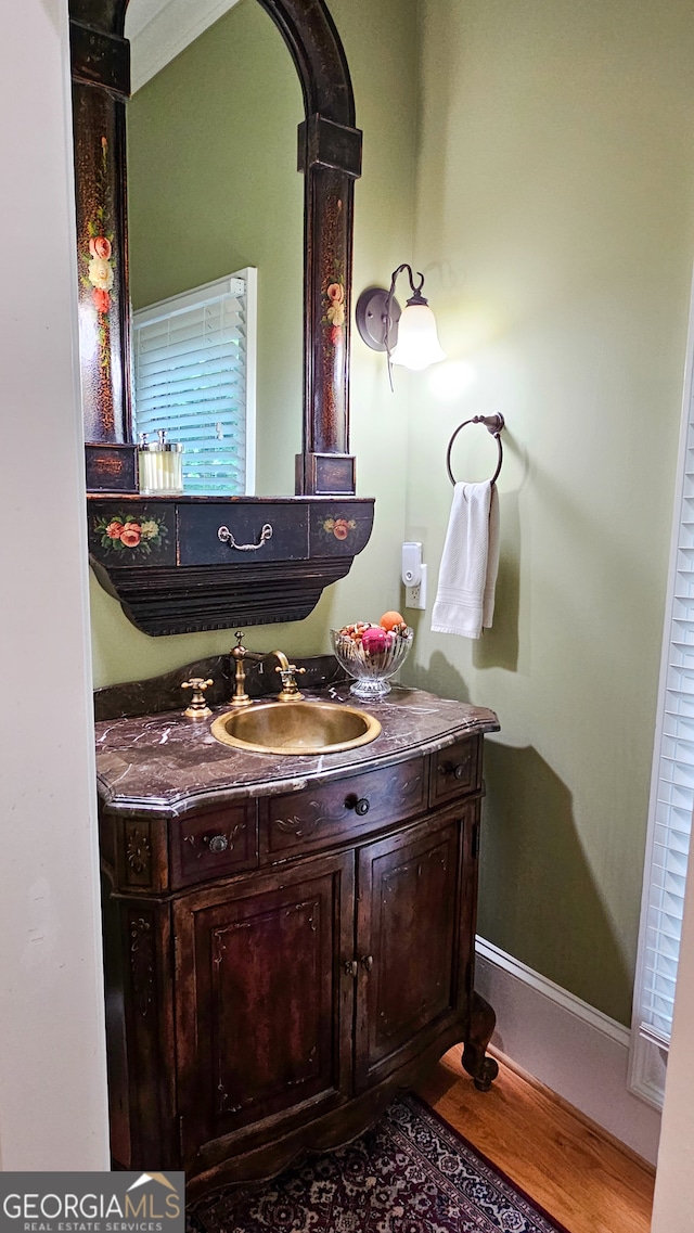 bathroom featuring vanity and hardwood / wood-style floors