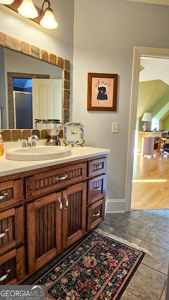 bathroom with vanity and hardwood / wood-style flooring