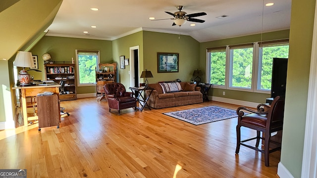 living room featuring light hardwood / wood-style flooring, a healthy amount of sunlight, and ceiling fan