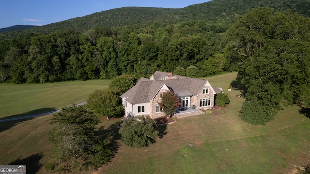 birds eye view of property with a mountain view