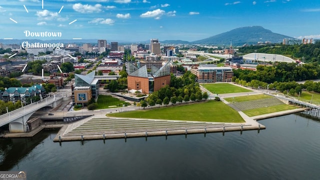 drone / aerial view with a water and mountain view