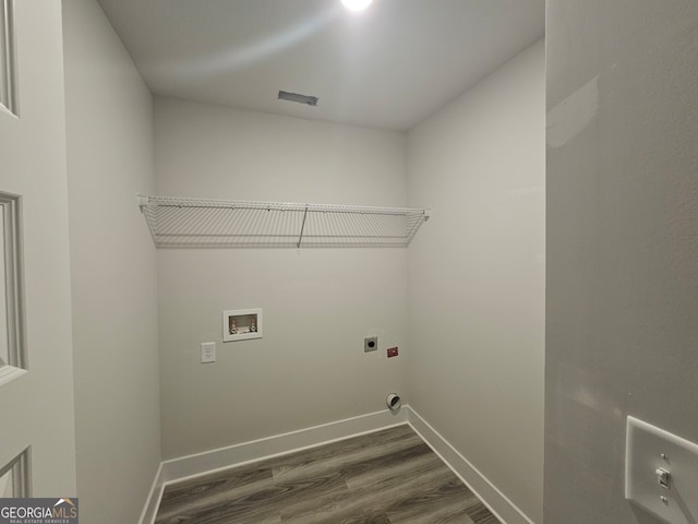 laundry room featuring hookup for a washing machine, dark wood-type flooring, and hookup for an electric dryer