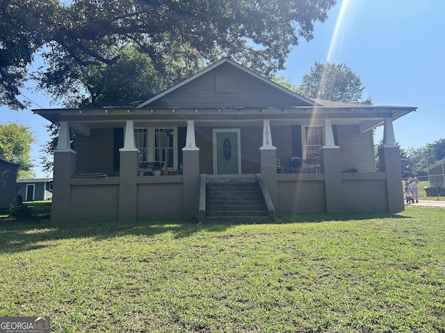 view of front of property with a front lawn and a porch