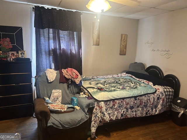 bedroom with hardwood / wood-style floors