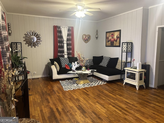 living room with ceiling fan, dark hardwood / wood-style floors, and ornamental molding