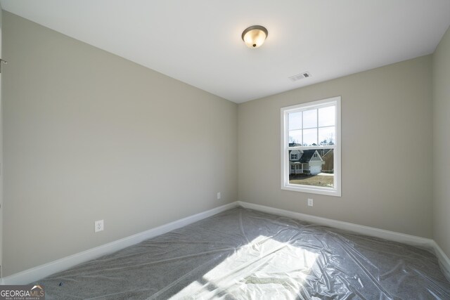 empty room featuring carpet flooring