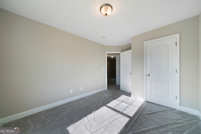 bedroom featuring dark colored carpet