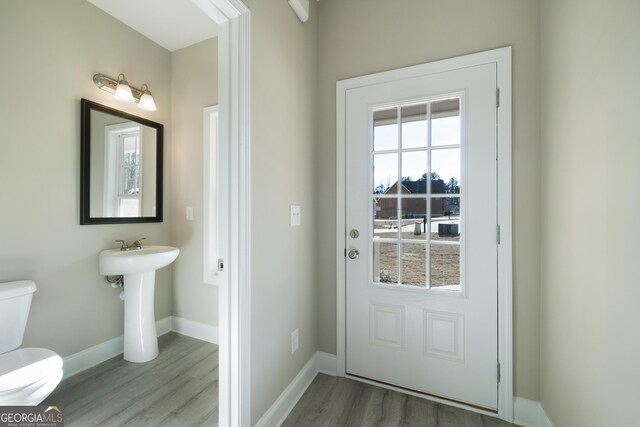 doorway to outside with hardwood / wood-style flooring