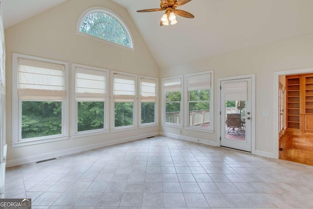 unfurnished sunroom with vaulted ceiling and ceiling fan