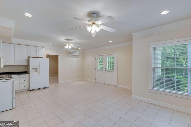 kitchen featuring white appliances, a wall unit AC, crown molding, ceiling fan, and white cabinets