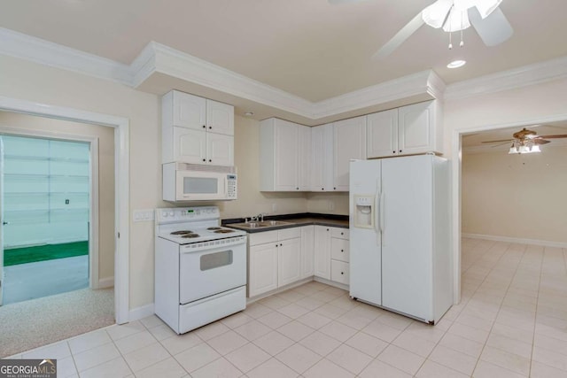 kitchen featuring white appliances, white cabinetry, and ornamental molding