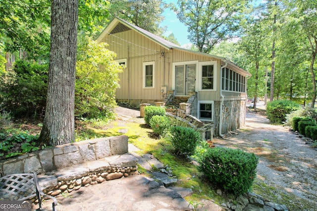 208 Colony Rd, Dillard, GA 30537 - view of front of property featuring a sunroom and board and batten siding