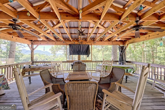 wooden deck featuring ceiling fan