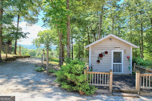 view of front of house featuring an outbuilding