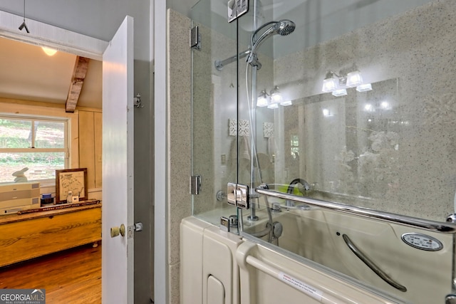 bathroom with beamed ceiling and wood-type flooring