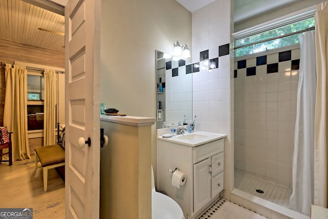 bathroom featuring vanity, wood-type flooring, walk in shower, tile walls, and toilet