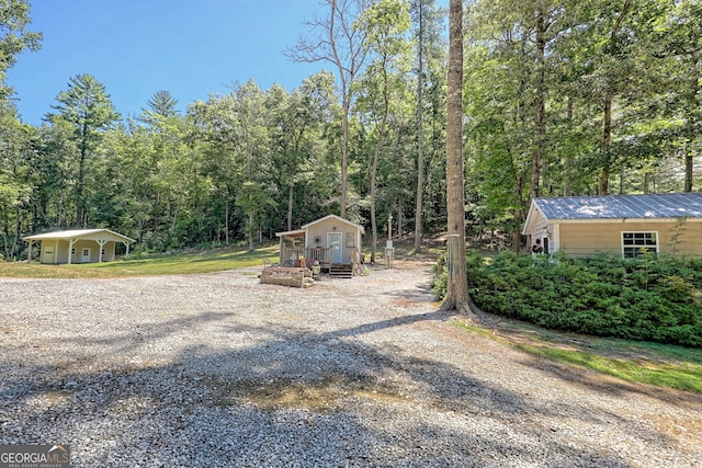 208 Colony Rd, Dillard, GA 30537 - view of yard featuring an outdoor structure and a forest view