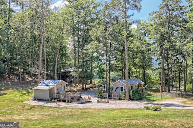 208 Colony Rd, Dillard, GA 30537 - view of yard featuring an outbuilding, a wooden deck, and an outdoor fire pit