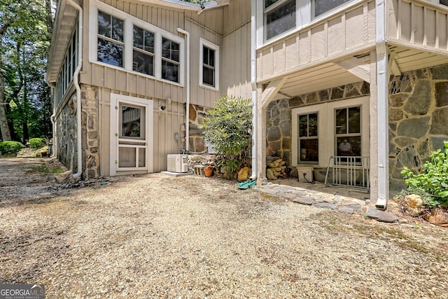 doorway to property with central AC unit