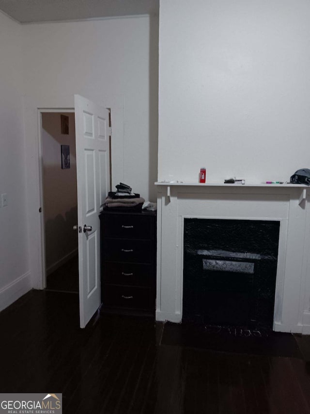 living room with dark hardwood / wood-style flooring