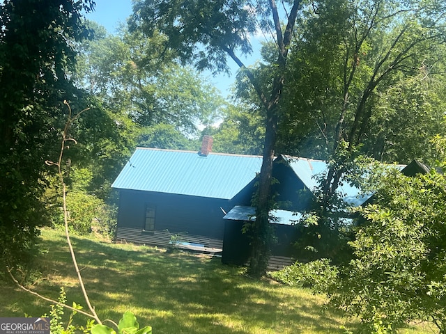 view of side of property with a yard