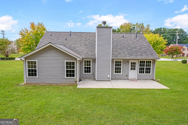 back of property with a patio and a yard