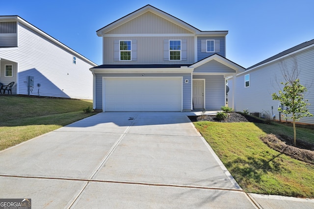 view of front property featuring a front yard and a garage