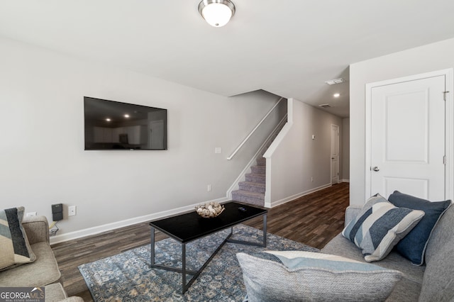 living room with dark hardwood / wood-style flooring