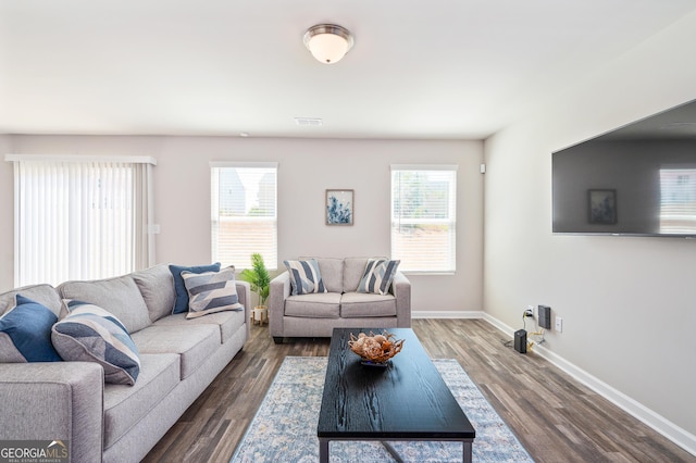 living room featuring dark hardwood / wood-style flooring