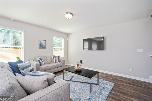 living room with dark wood-type flooring