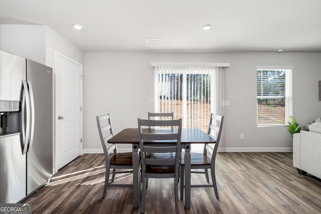 dining room with dark hardwood / wood-style flooring