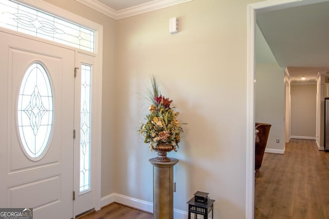 entryway featuring hardwood / wood-style floors and crown molding