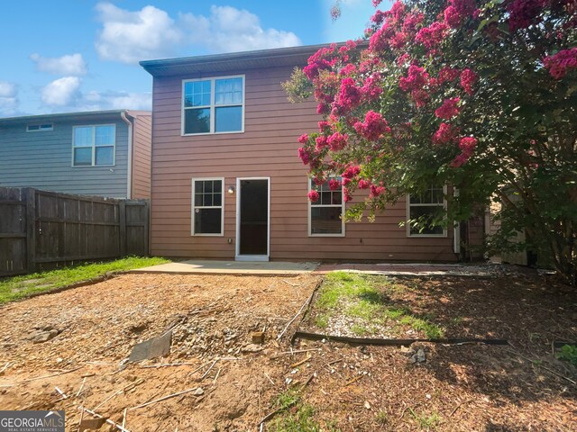 back of property with a patio area