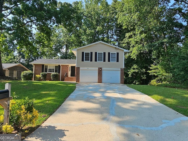 tri-level home featuring a garage and a front lawn