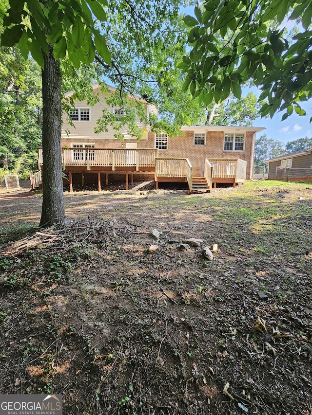 back of property with a deck