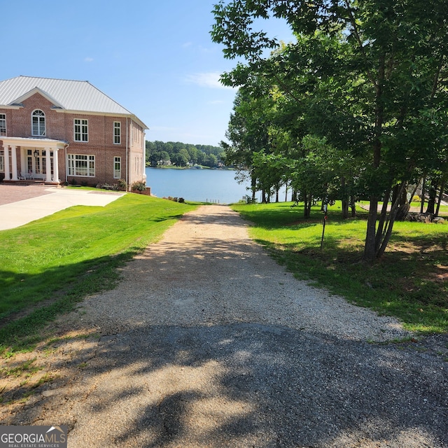 exterior space with a water view