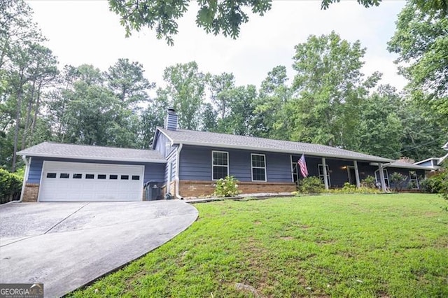 view of front of house with a front yard and a garage