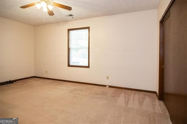 unfurnished bedroom with ceiling fan and light carpet