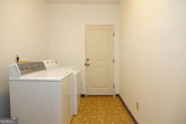 laundry area featuring washing machine and clothes dryer