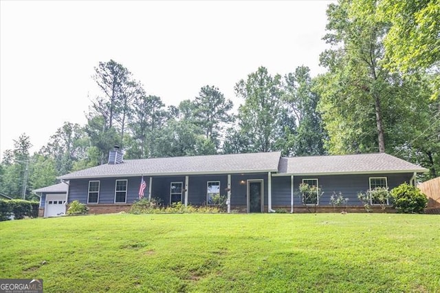 single story home featuring a front yard and a garage