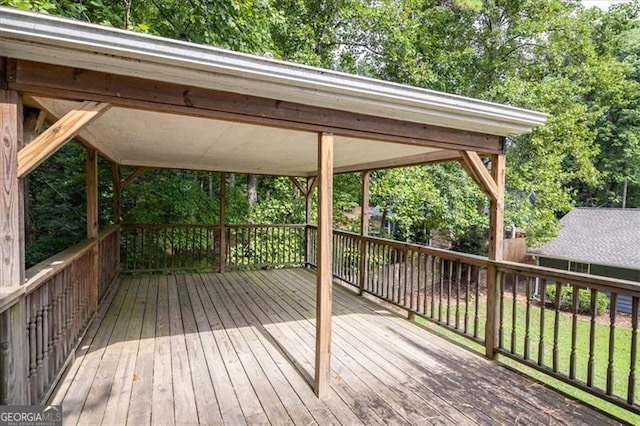 wooden terrace with a yard